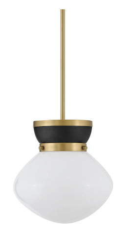 A modern pendant light with a brass rod, black accent, and a round frosted glass shade.