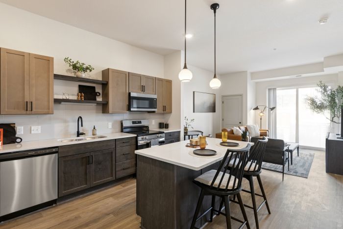 Modern Apartment Kitchen featuring stainless steel applainces, and two-toned cabinetry at Belterra Apartments in Plymouth MN