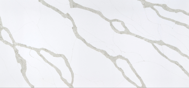 White marble surface with irregular, light gray veining running diagonally across the image.