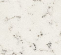 White marble surface with subtle gray veining in an irregular, natural pattern.